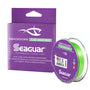 A spool of Seaguar Smackdown braid fishing line in Flash Green color, alongside its packaging with the brand and product name visible.