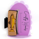 Brown Trout Hairclips Medium Wood background Black Clip 1