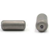 Two cylindrical tungsten carolina weights on a white background