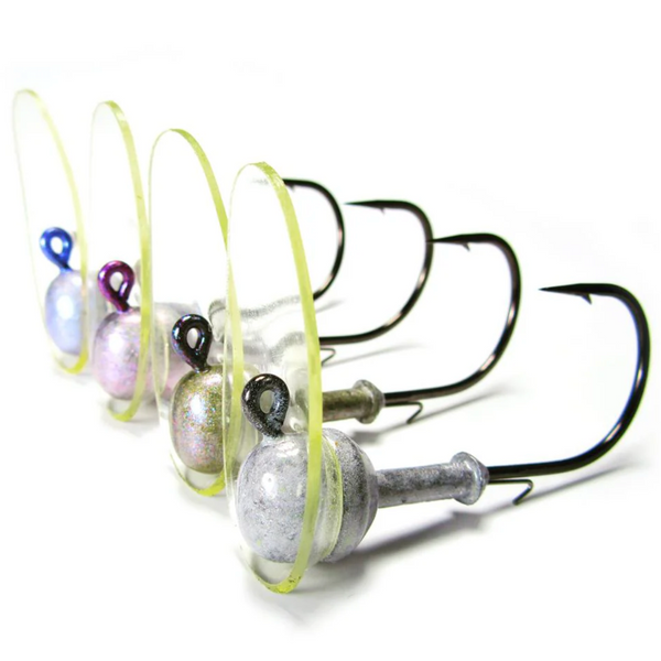 A selection of Hog Farmer Baits Hog Wobbler fishing lures with grooved ball heads and barbed hooks, displayed in a row with different colored beads.