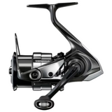 A black and silver Shimano Vanish spinning fishing reel with a step-on handle, shown from a side profile view on a white background.